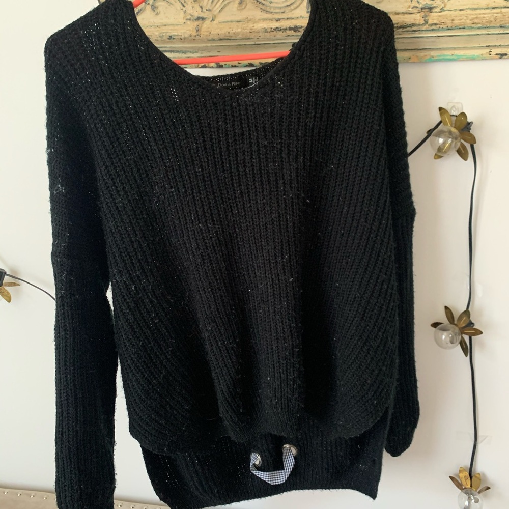 black sweater with criss cross tie detail
